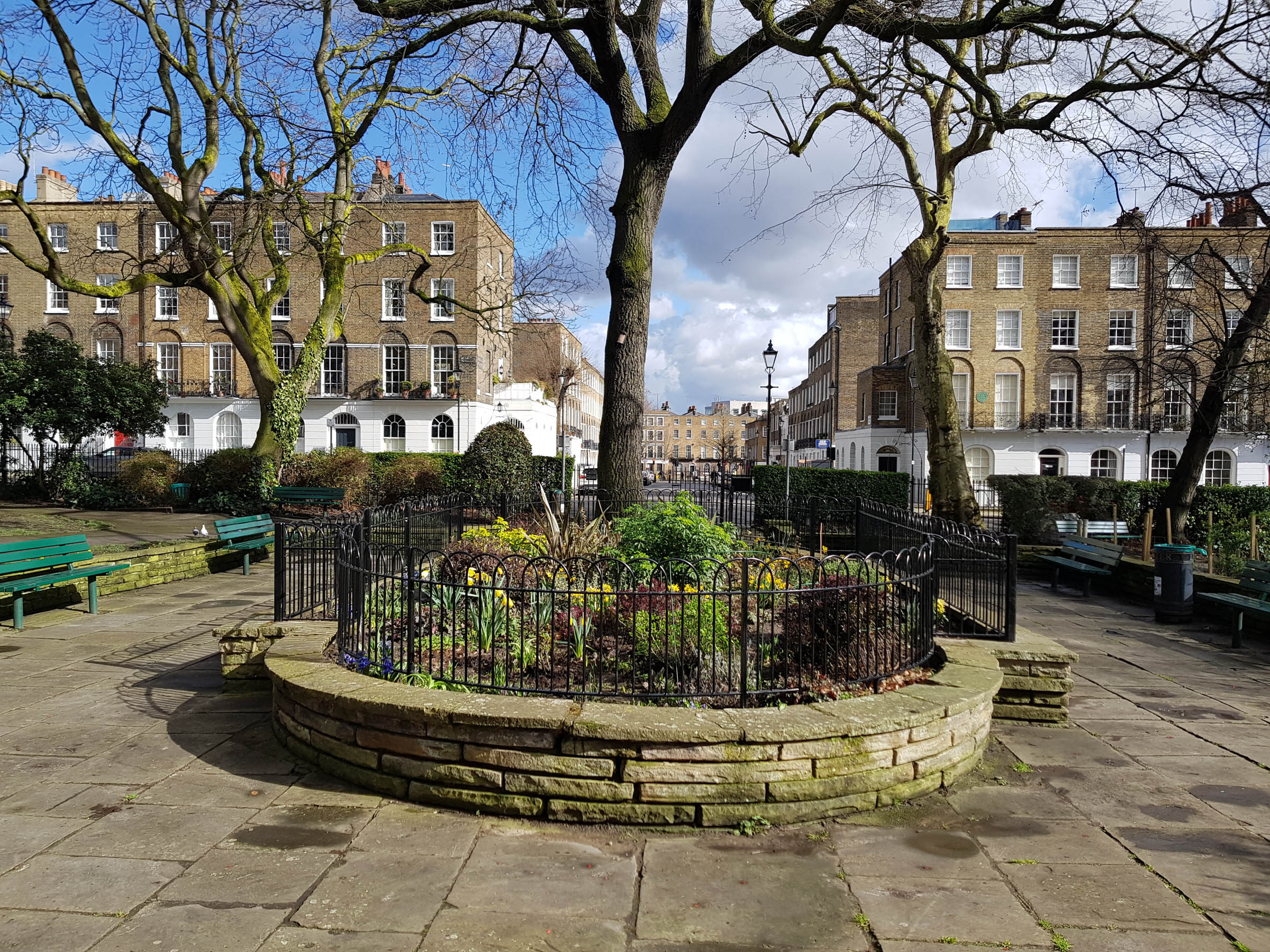 The centre flower bed after restoration and installation of new railings.